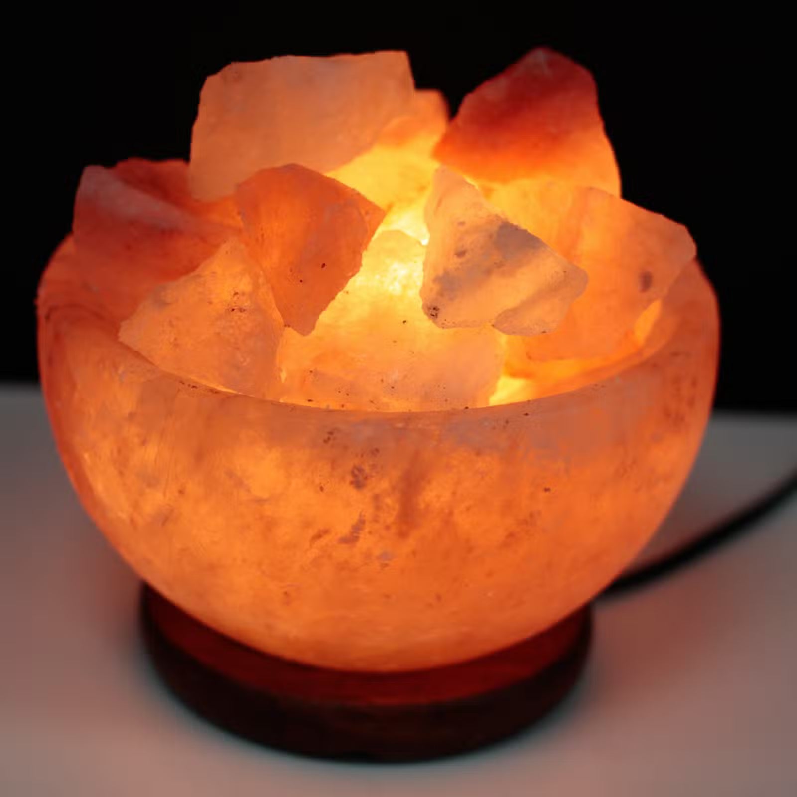 Natural Himalayan salt fire bowl with glowing salt chunks — Eternal Glow ionic air purifier for home wellness, stress relief, and warm ambient lighting.