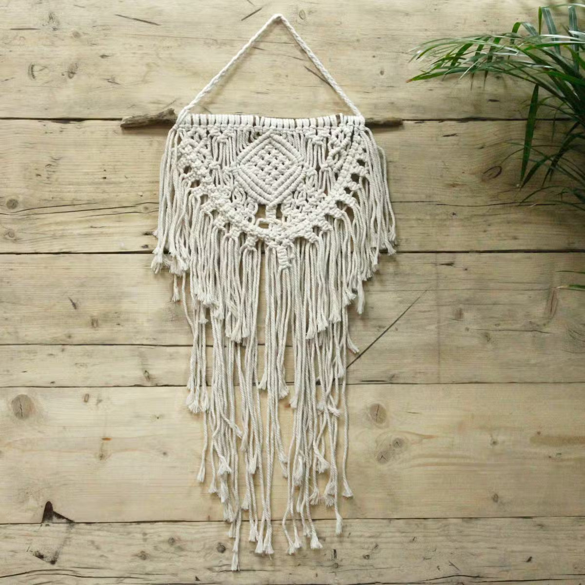 Hand-woven cotton macrame wall hanging collection — Set of bohemian textile art for home gallery walls, featuring intricate heart designs and organic textures.