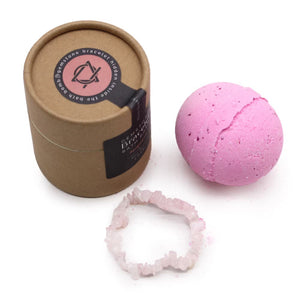 Luxury Rose Quartz Glow bath bomb with a hidden gemstone bracelet inside — Artisan bath fizzy scented with wild rose and patchouli for self-love and heart chakra wellness.